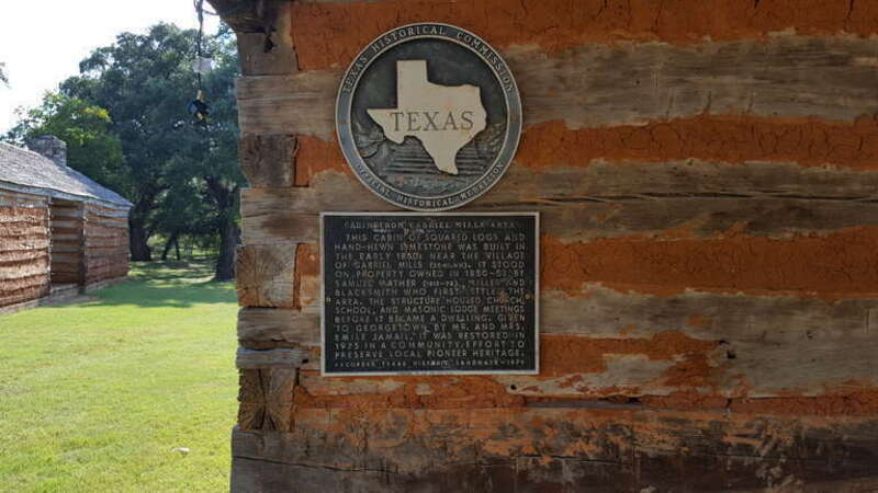 Marker describing the cabin of squared logs and hand-hewn limestone built in the early 1850s near the village of Gabriel Mills, Texas.  It stood on property owned in 1850-53 by Samuel Mather (1812-78), miller and blacksmith who first settled the