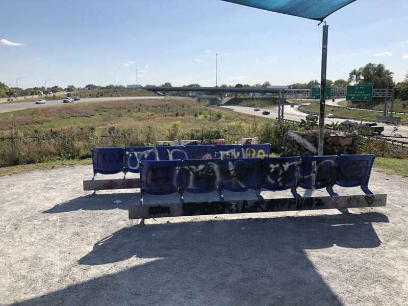 This image depicts outdoor seating overlooking the South Split Interchange (Interstates 65 and 70) at The Idle in Indianapolis, Indiana, U.S. The public park opened in 2018.