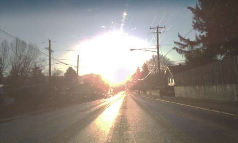 The sun rising from the end of Tieton Drive makes a wet morning commute an experience to behold