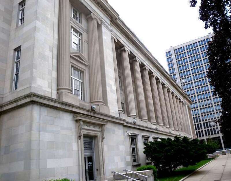 Looking southwest from Franklin Street along colonnade of en:United States District Court for the District of New Jersey and Post Office in Newark on a mostly sunny midday.