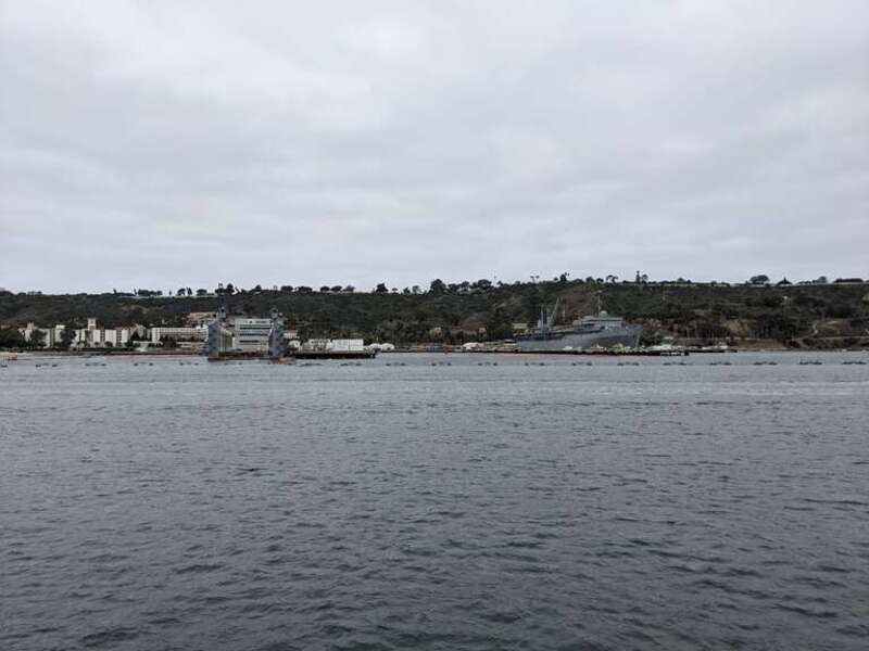 USS Emory S. Land (AS-39) on the right, at port in Point Loma, San Diego