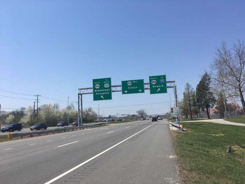 Westbound U.S. Route 40 (Pulaski Highway) approaching the intersection with U.S. Route 301/Delaware Route 896 (Summit Bridge Road/South College Avenue) in Glasgow, Delaware