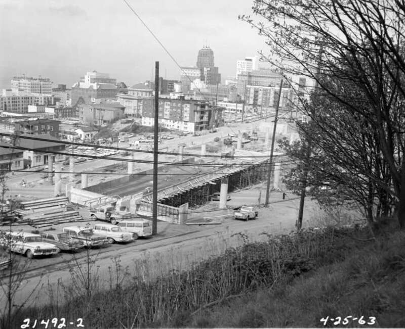 View of Downtown Seattle, Washington, U.S. from Yesler Terrace area, 1963. Interstate 5 under construction.