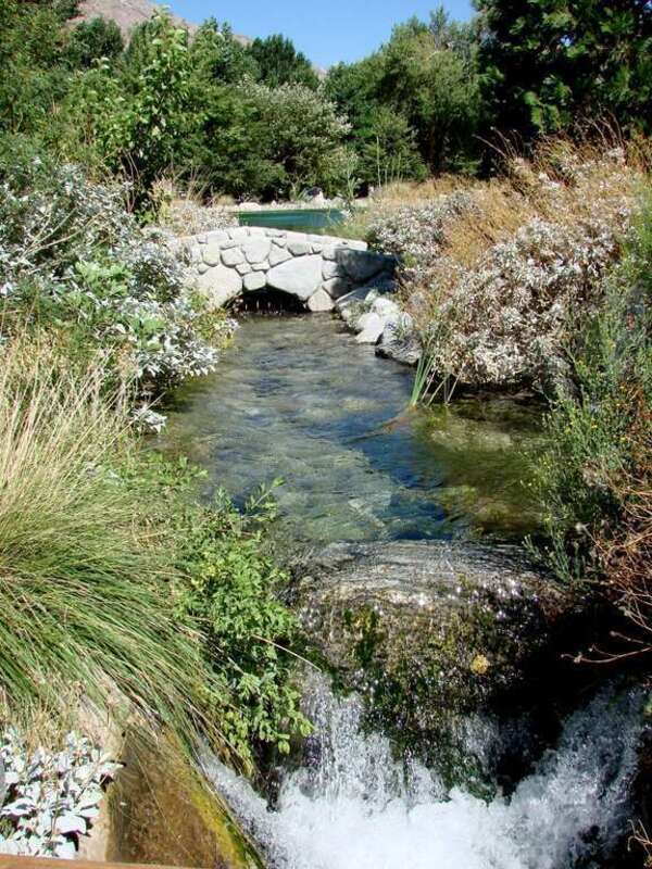 (1 of a 7-picture set)
One of many beaufiful scenes where a pond empties into a stream which flows under a bridge into a lower pond.