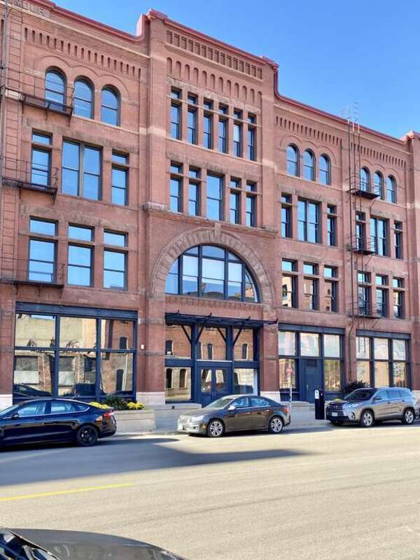 Built in 1890, this Romanesque Revival and Queen Anne-style warehouse was designed by F. B. Hart, and was built as the Seymour Building, though it historically was known as the Williams Hardware Company Building, after the Williams Hardware Company,