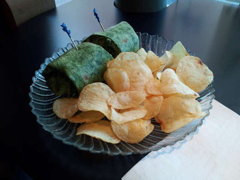 A vegetarian wrap and potato chips from Mug Shots, an independent coffee shop in downtown Staunton, Virginia at the corner of Johnson and New Streets.

Ben Schumin is a professional photographer who captures the intricacies of daily life.  This image