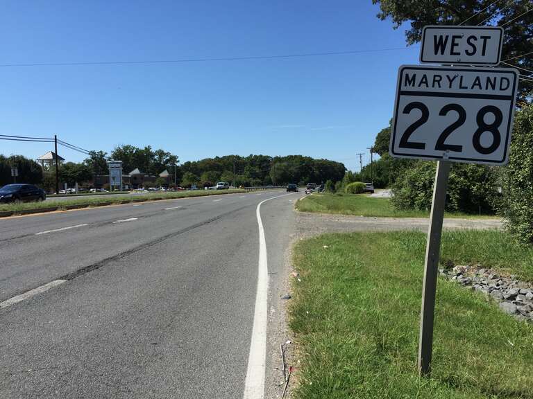 View west along Maryland State Route 228 (Berry Road) at Western Parkway in Waldorf, Charles County, Maryland