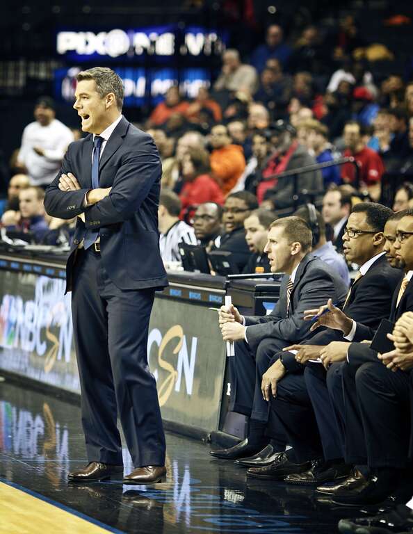 Tony Bennett and his assistants during the championship game of the Barclays Classic at the Barclays Center, Brooklyn, NY. Virginia defeated Rutgers in a record defensive effort, 45-26.