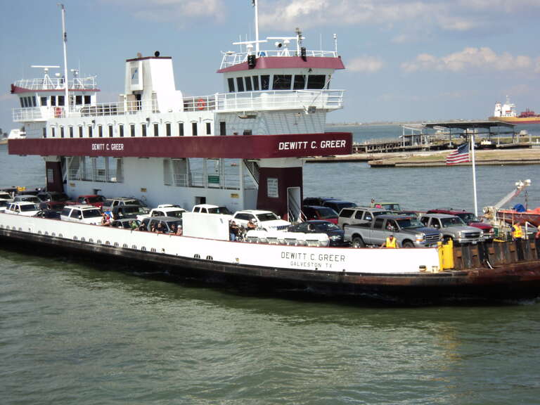 Bolivar Ferry - Galveston, Tx. There are five ferry boats in the fleet. The two smaller ferries carry an average of sixty-nine cars. The larger boats, the Gibb Gilchrist, Robert Lanier, and the Dewitt Greer you see here accommodate eighty-five cars.