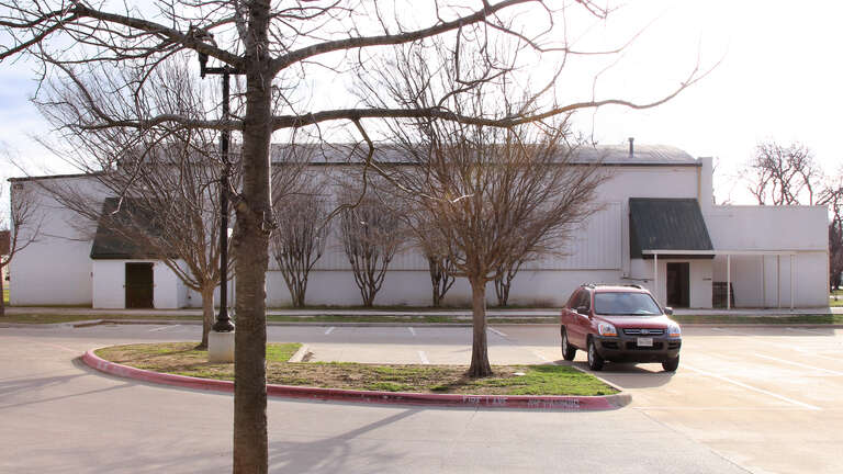 West side of the old Burleson Gymnasium in Burleson, Texas, United States.