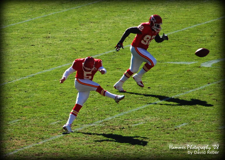 Photo of 2 men playing football. www.DavidReber.com