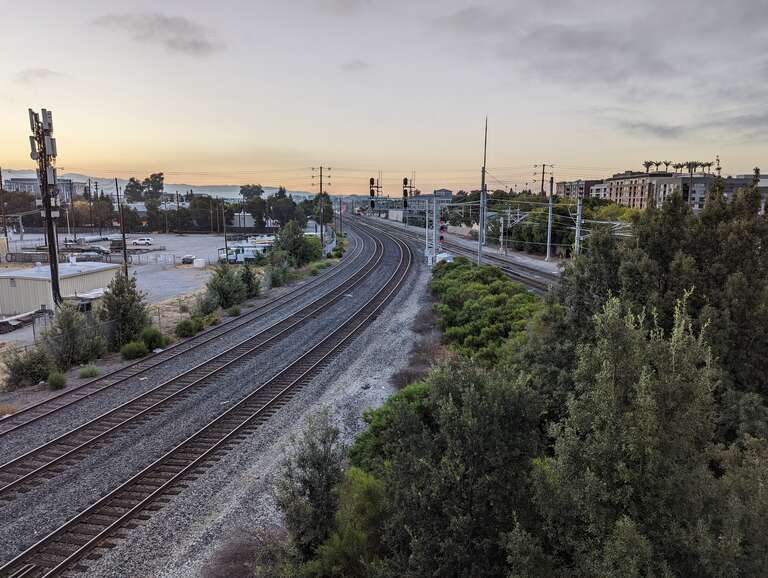 The Coast Subdivision (left) splits from the Peninsula Corridor just north of Santa Clara station. This view is directed south from the De La Cruz flyover connecting Coleman and El Camino Real.