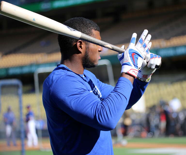 Dodgers outfielder Yasiel Puig warms up during batting practice before NLCS Game 4.