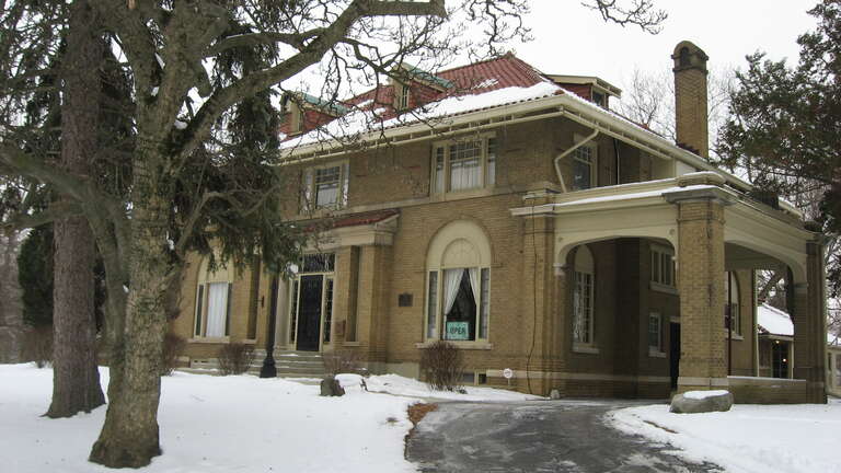 Front of the Elwood Haynes House, located at 1915 S. Webster Street in southwestern Kokomo, Indiana, United States.  Built in 1916 as the home of Elwood Haynes and later converted into a museum, it is listed on the National Register of Historic