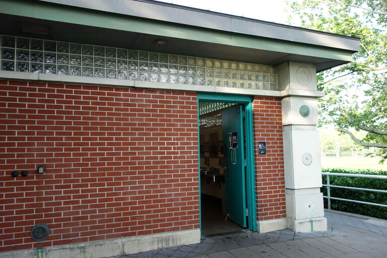 The comfort station at the north end of Meadow Lake near the former World's Fair grounds of Flushing Meadows–Corona Park, at Meadowlark Circle south of the Long Island Expressway near Corona, Queens.