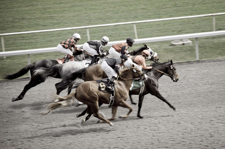 Jockeys Riding Horse in Race.