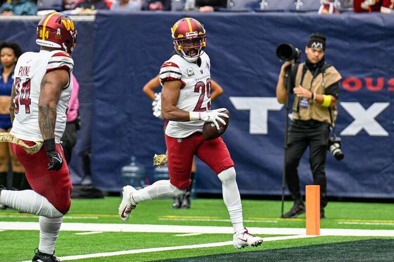 Washington Commanders cornerback, Kendall Fuller, returns an interception for a touchdown in a game against the Houston Texans at NRG Stadium, Houston, Texas on November 20, 2022.