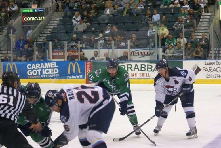 Mathieu Roy of the Florida Everblades and Ryan Murphy of the Charlotte Checkers wait for the face-off in an ECHL hockey game on 3-9-09