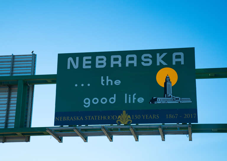 A Nebraska welcome sign on the Siouxland Veterans Memorial Bridge over the Missouri River, between Sioux City, Iowa and South Sioux City, Nebraska: &quot;Nebraska ... the good life - Nebraska Statehood 150 years 1867-2017&quot;