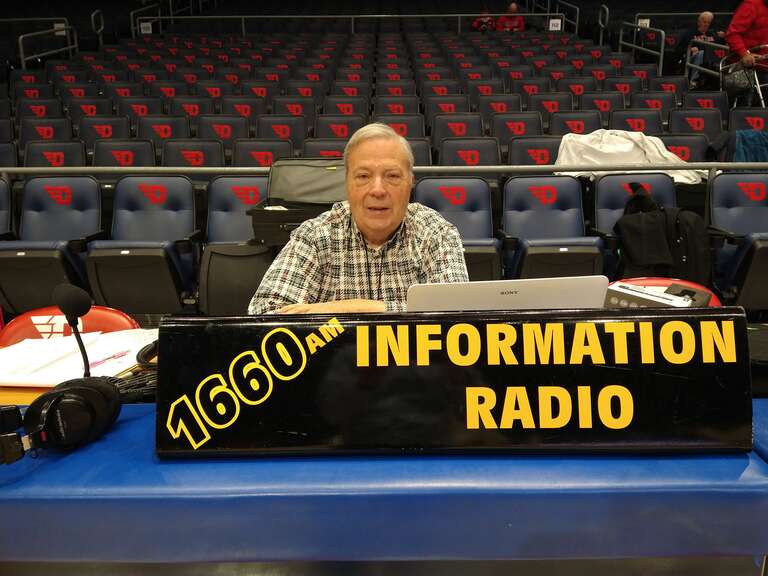 Norm Schrein at the broadcast position prior to a basketball game at UD Arena in Dayton, OH