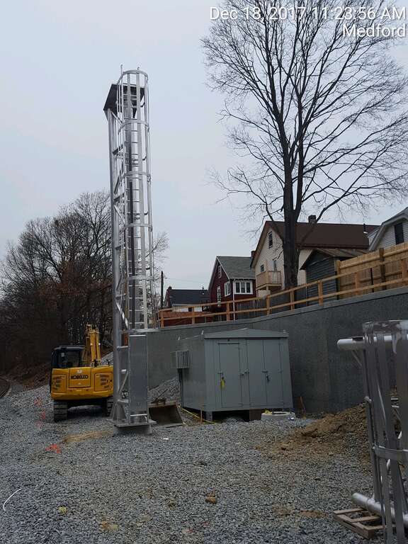 Erection of Tufts Interlocking North Signal Tower, north of College Avenue Bridge, behind Burget Avenue, Medford.
