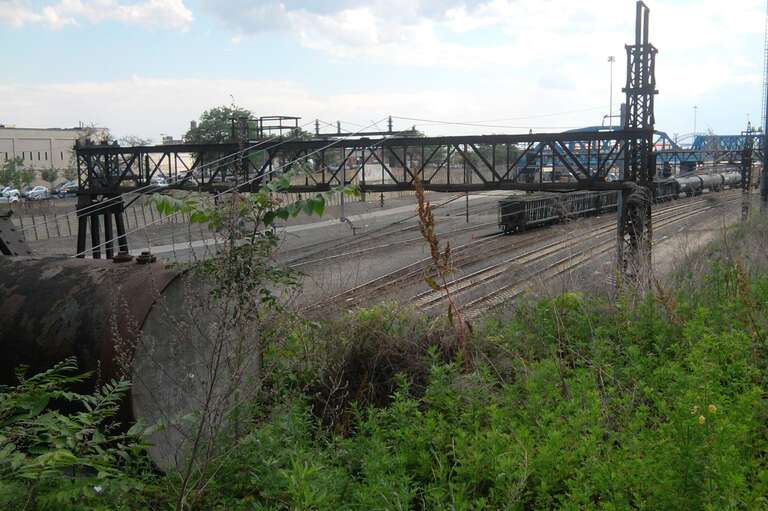 Looking south from Longwood Avenue overpass at northern part of Oak Point Yard on a mostly sunny afternoon.