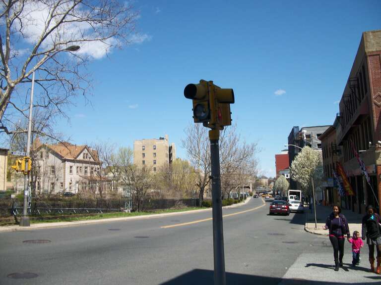 An old, odd, two-light traffic signal on the southwest corner of the intersection of South Eighth Avenue and West First Street in Mount Vernon, New York. Don't ask me why, but these had red and yellow lights, instead of red and green. The broken lens