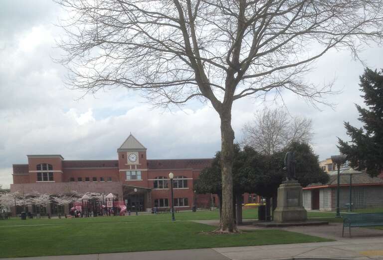 Pioneer Park, Puyallup, Washington.  The library is in the background, the Meeker statue and site of his first homestead in Puyallup are on the right (not the small building, that's the public restrooms).