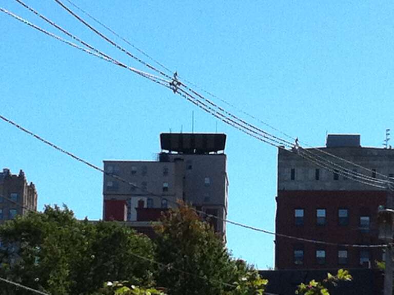 A Photo Of The Time And Temperature Sign Turned Off.