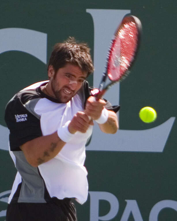 Tipsarevic hits a backhand in his close loss at the 2008 Pacific Life Open.  He lost 6-4, 3-6, 7-6(4) to Nicolas Massu in the first round.