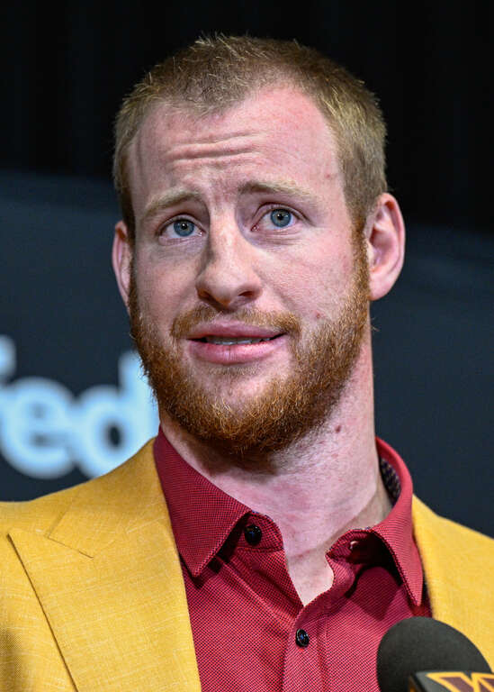 Washington Commanders quarterback Carson Wentz speaks with reporters during his introductory press conference at Inova Sports Performance Center in Ashburn, Va., March 17, 2022. (Photo by Brian Murphy, All-Pro Reels)