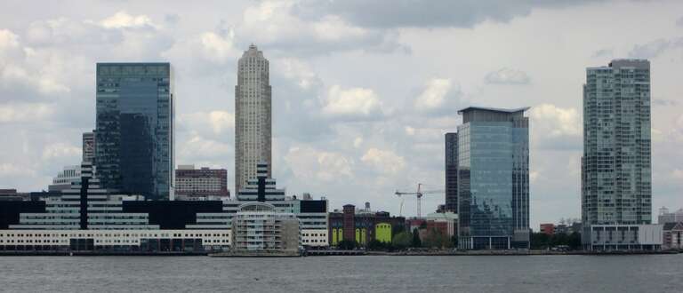 Skyline of Jersey City, New Jersey, taken from Rockefeller Park in Battery Park City, Manhattan, New York City.  South is to the left.  Buildings include (from left to right):

Harborside Financial Center - complex of buildings of various sizes,