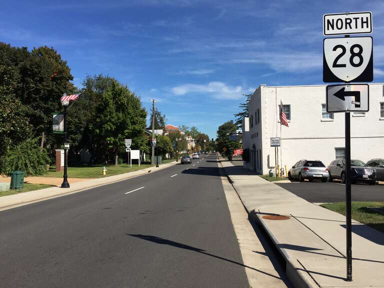 View north along Virginia State Route 28 (Center Street) between East Street and Zebedee Street in Manassas, Virginia