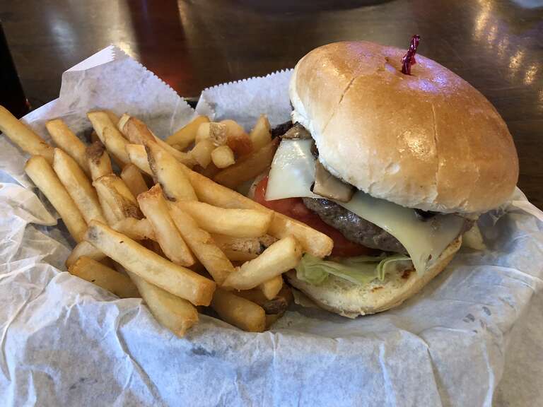 A mushroom cheeseburger and french fries at Texas Tradition in Katy, Harris County, Texas