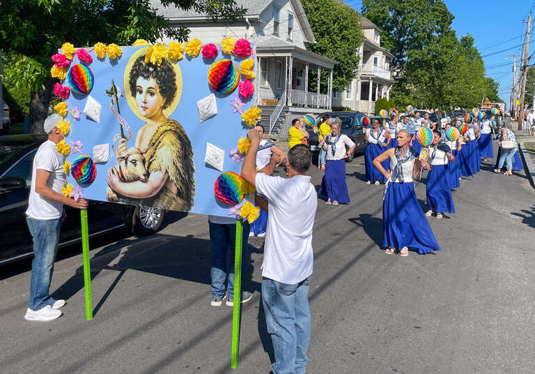 Dancers in the Bodo de Leite parade on Orchard Street in East Providence, Rhode Island. Sponsored by the Holy Ghost Beneficial Brotherhood of Rhode Island.