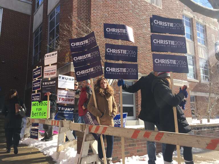 Candidates' posters on display in front of a polling station in Ward 1, Manchester, New Hampshire, Feb. 9, 2016. (Photo: K. Gypson / VOA)