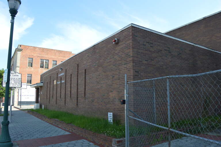 Front of the Carrons Funeral Home, located at 325 E. Nash Street in Wilson, North Carolina, United States.  The historical marker at far left indicates that it occupies the site of the birthplace of historian Robert Digges Wimberly Connor.