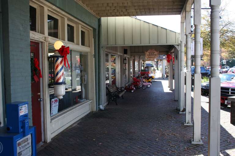 A view of Downtown Northport Alabama, standing in front of the barber shop and looking South toward the river.