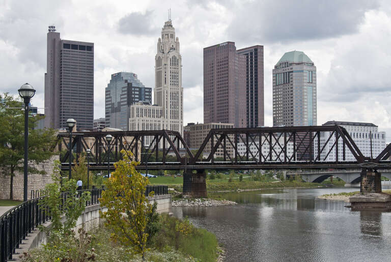 Downtown Columbus from the Scioto Greenway. Tall buildings from left to right is the Rhodes State Office Tower, One Columbus Center (The one with the US Bank sign), LeVeque Tower, Huntington Center, Vern Riffe State Office Tower. There are many
