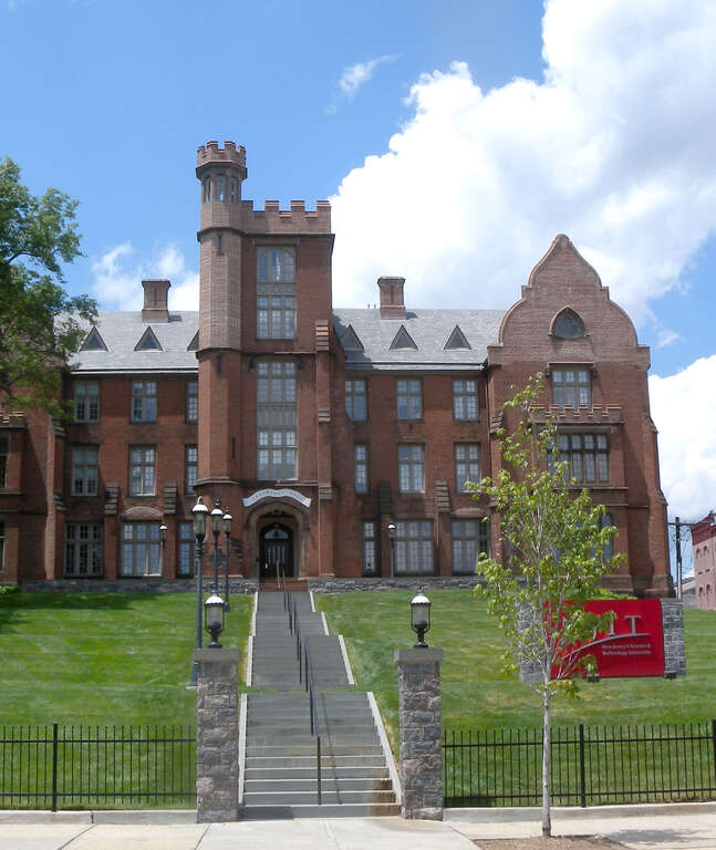 Looking west and up from Bleecker Street at Eberhardt Hall, New Jersey Institute of Technology — in Newark, New Jersey.
The brick Gothic Revival style building was completed in 1857.
&quot;Seen on a mostly sunny afternoon in 2009.&quot;
