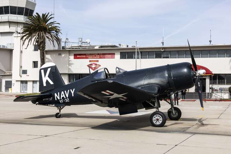 A World War II (WWII) era Vought F4U Corsair is staged on Marine Corps Air Station Miramar, California, Feb. 16, 2023. The Corsair landed following a flyover of the funeral for retired U.S. Marine Corps Maj. John H. Tashjian, who flew the pictured