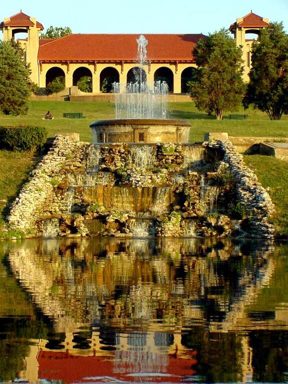 Government Hill in Forest Park in St. Louis, Missouri as it once appeared, with the World's Fair Pavilion at the top of the hill. The hill has changed and the fountain replaced with a different fountain since this picture was taken.Forest Park, St.