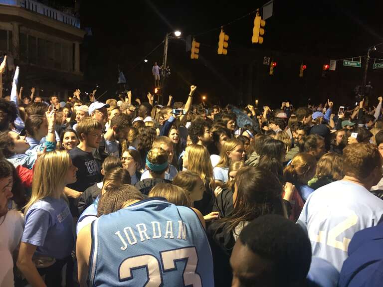 The crowd at the intersection of Franklin Street and North Columbia Street in Chapel Hill, North Carolina after the UNC-Chapel Hill victory over Gonzaga in the 2017 NCAA Division I Men's Basketball Championship.