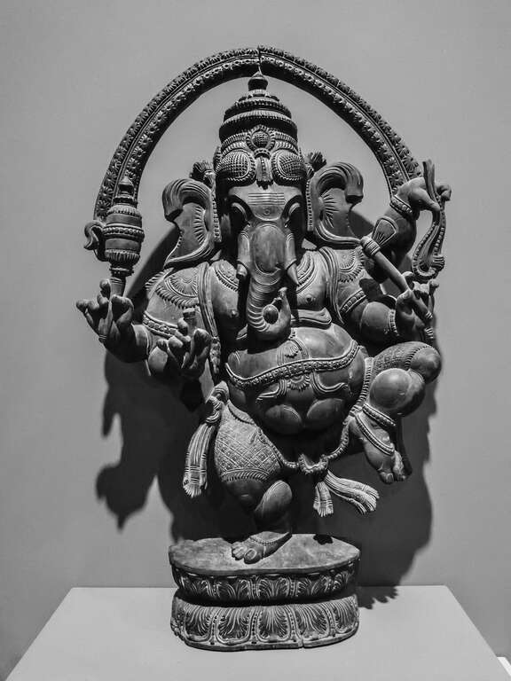 500px provided description: Wooden carving of Ganesha from India (Tamil), 20th century [#travel ,#black and white ,#statue ,#wood ,#sculpture ,#hawaii ,#god ,#elephant ,#carving ,#ganesha ,#deity ,#honolulu ,#hindusim ,#India ,#USA ,#Tamil