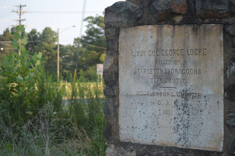 This monument, placed near the NC 29-NC 49 connector by the Daughters of the American Revolution, honors Lieutenant Colonel George Locke, who was killed in 1780 by Banastre Tarleton's Green Dragoons.