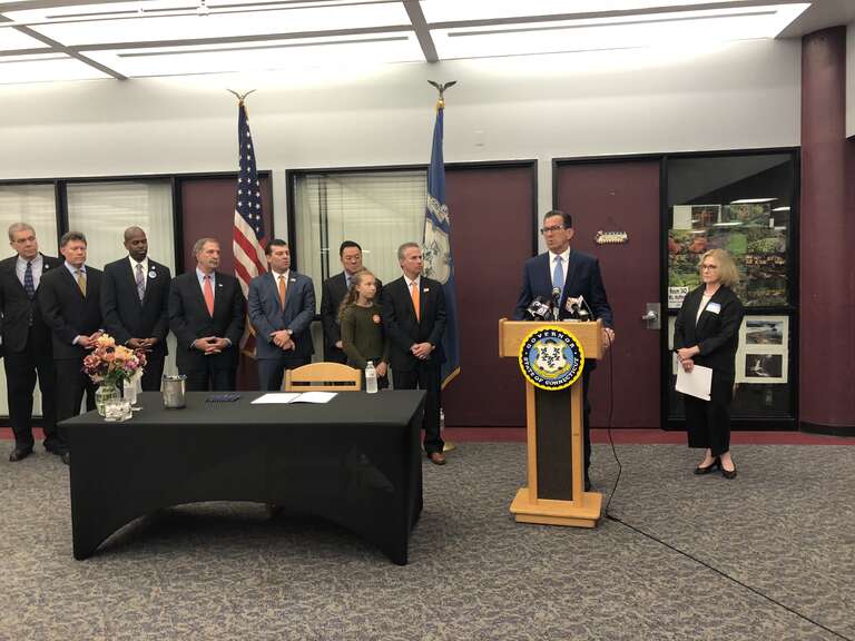 Thursday, May 31, 2018 -- Governor Dannel P. Malloy today signed into law legislation that bans bump stocks and other enhancements that increase the rate of fire for semiautomatic weapons, including trigger cranks, binary trigger systems, and other