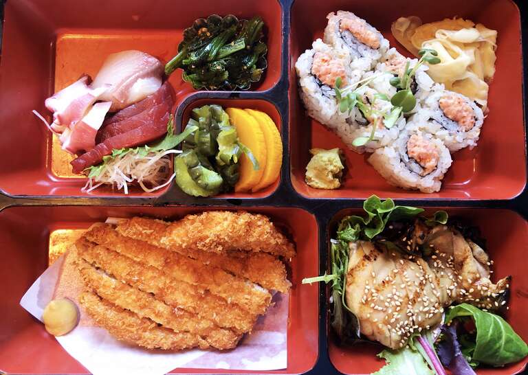 Bento Box with sashimi, spicy tuna roll, tonkatsu, and chicken teriyaki at Hana Japanese Restaurant in Rohnert Park, California.
