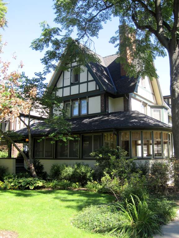 The Harrison P. Young House in the Frank Lloyd Wright-Prairie School of Architecture Historic District in Oak Park  (1870s, remodel 1895). It was built in the 1870s and remodeled by Frank Lloyd Wright in 1895. Its steeply pitched roof contrasted with