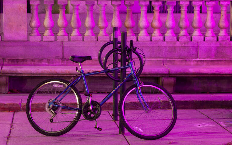 This bike was parked in front of Portland, Maine's City Hall last month when the building was being illuminated by pink lights.