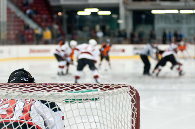 Frazee looks on as the ref drops the puck at center ice.